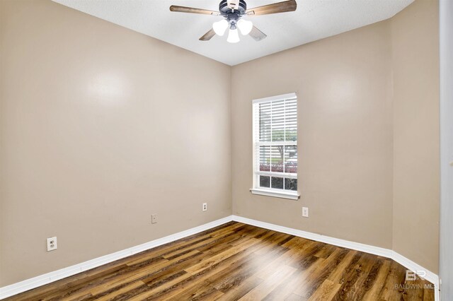 2651 S Juniper St Unit 1201, Foley, AL 36535 - unfurnished room featuring baseboards, dark wood-type flooring, and a ceiling fan