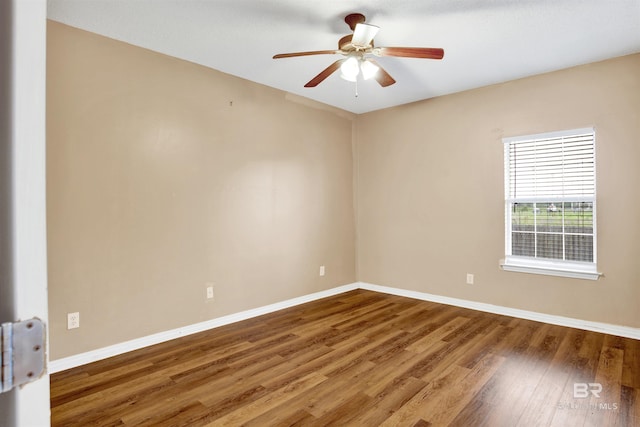 2651 S Juniper St Unit 1201, Foley, AL 36535 - spare room featuring wood finished floors, baseboards, and a ceiling fan