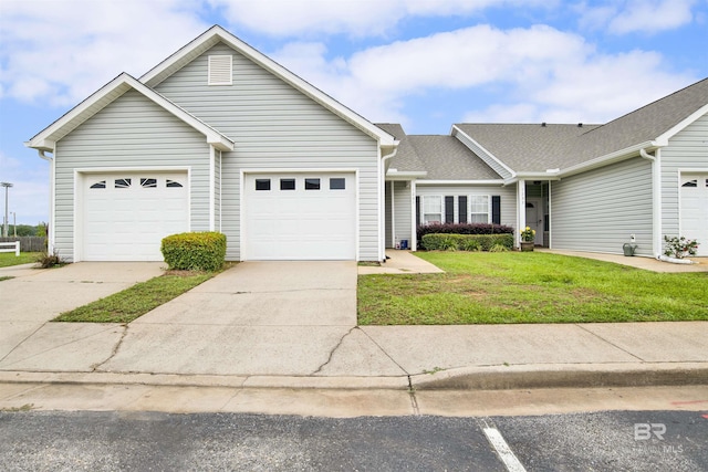 2651 S Juniper St Unit 1201, Foley, AL 36535 - view of front facade with a front yard, driveway, and a garage