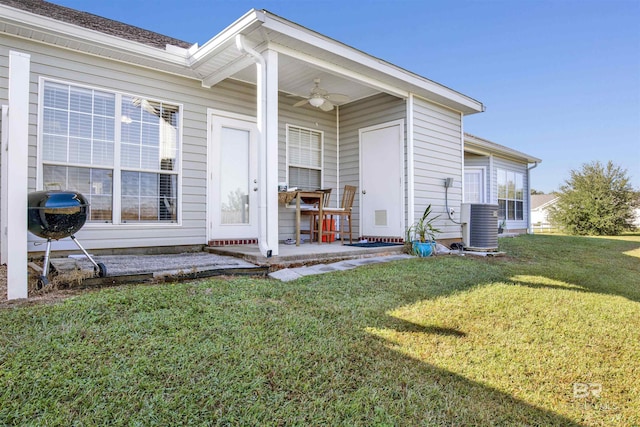 2651 S Juniper St Unit 1201, Foley, AL 36535 - property entrance featuring a ceiling fan, a lawn, central AC, and a patio area