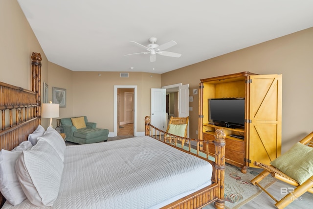 bedroom with ceiling fan, access to outside, dark hardwood / wood-style floors, and floor to ceiling windows