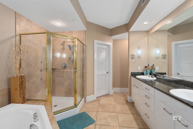 bathroom featuring vanity and separate shower and tub