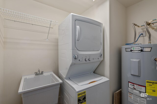 bathroom featuring toilet, a shower with shower door, vanity, and tile patterned floors