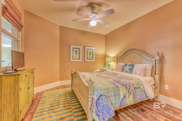 bedroom featuring light hardwood / wood-style floors and ceiling fan