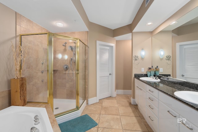 bathroom featuring vanity, plus walk in shower, and tile patterned floors