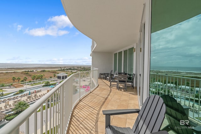 balcony featuring a water view