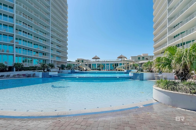 view of swimming pool featuring pool water feature