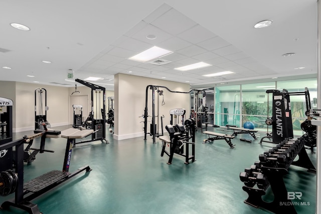 workout area featuring a paneled ceiling