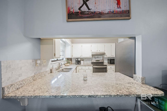 kitchen featuring white cabinetry, stainless steel electric range, light stone counters, sink, and kitchen peninsula