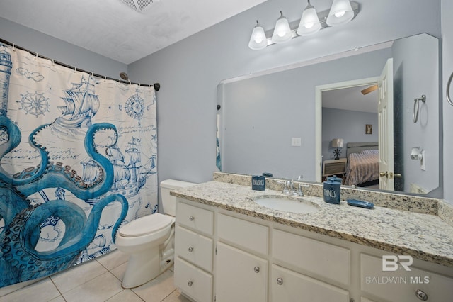 bathroom featuring tile patterned floors, toilet, curtained shower, and vanity