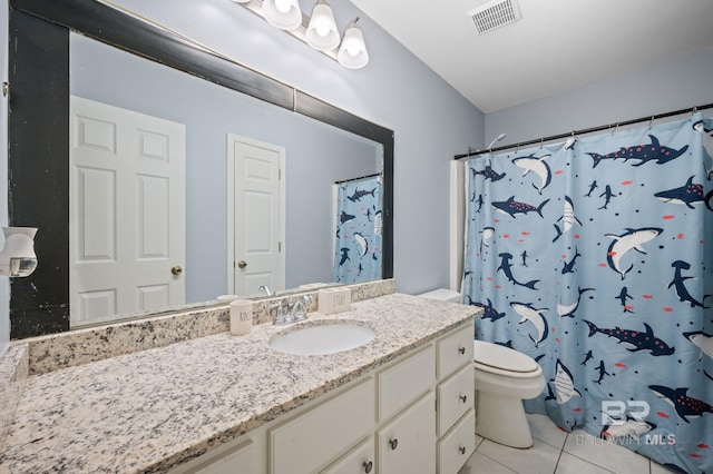 bathroom featuring vanity, toilet, a shower with curtain, and tile patterned flooring