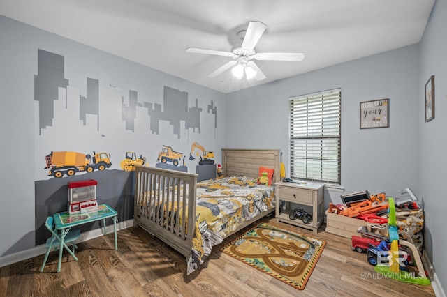 bedroom featuring ceiling fan and dark hardwood / wood-style floors