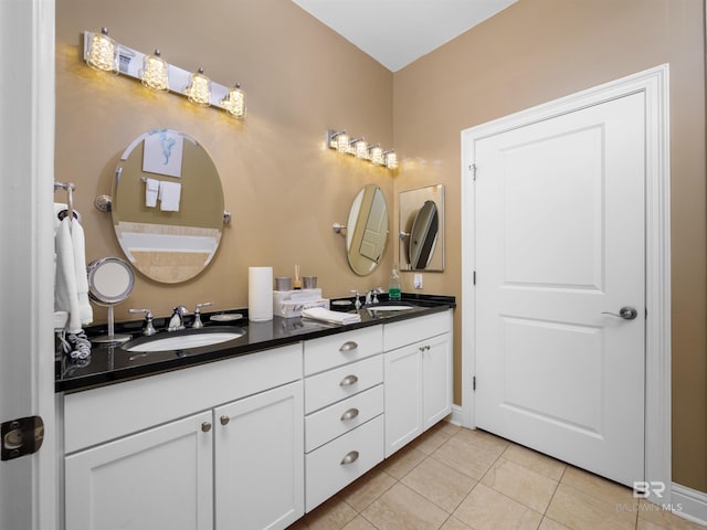 bathroom with tile patterned flooring and vanity