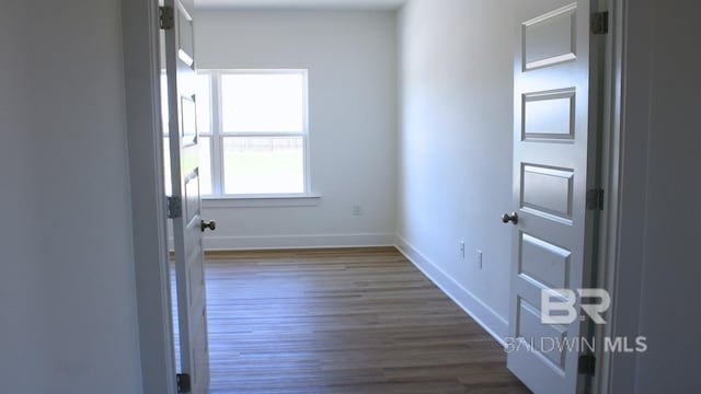 12681 Shoshoney Cir, Fairhope, AL 36532 - empty room with dark wood-type flooring and baseboards