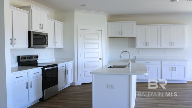 12681 Shoshoney Cir, Fairhope, AL 36532 - kitchen with stainless steel appliances, a sink, dark wood-style floors, a center island with sink, and ornamental molding
