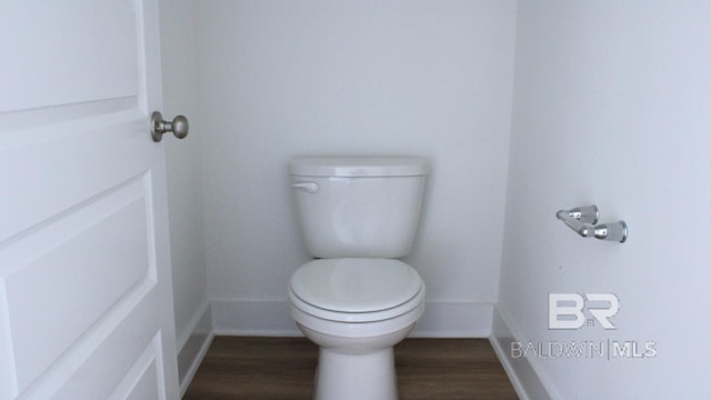 12681 Shoshoney Cir, Fairhope, AL 36532 - bathroom featuring toilet, wood finished floors, and baseboards