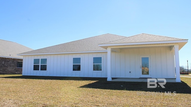 12681 Shoshoney Cir, Fairhope, AL 36532 - back of property featuring board and batten siding, a shingled roof, and a yard