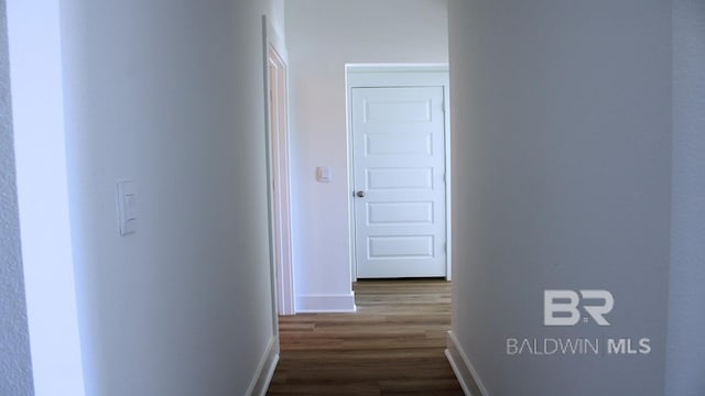 12681 Shoshoney Cir, Fairhope, AL 36532 - hallway with dark wood-type flooring and baseboards