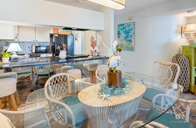 dining area with wood-type flooring