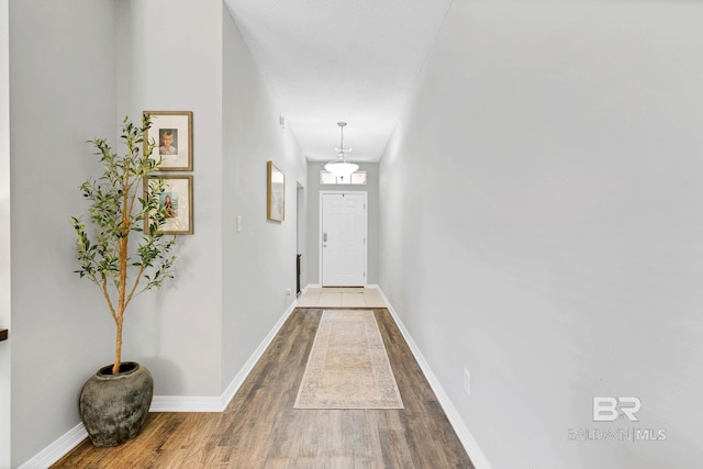 3677 Ashton Ct, Gulf Shores, AL 36542 - doorway featuring wood finished floors and baseboards