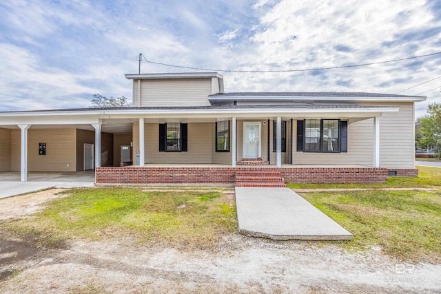 view of front of property with a porch and a carport