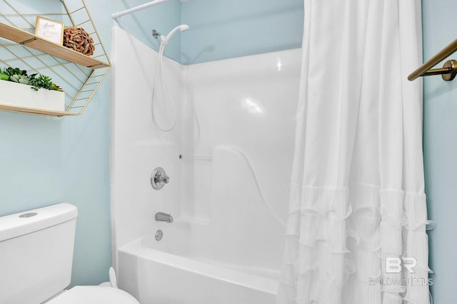 bathroom with toilet and shower / bath combo