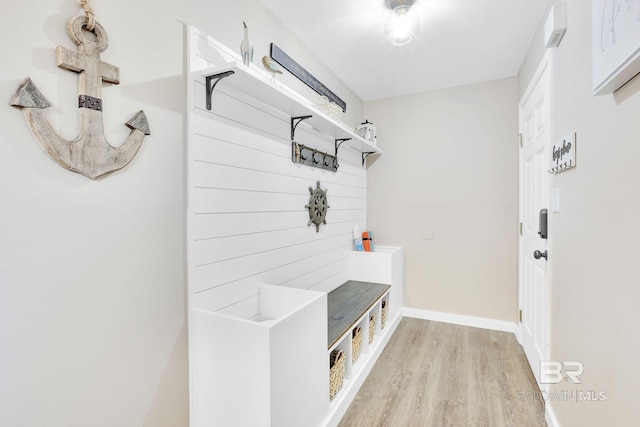 mudroom with light hardwood / wood-style flooring