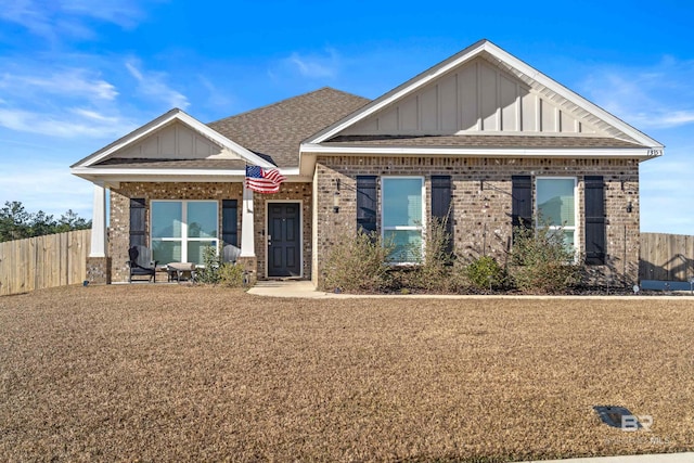 craftsman-style house with a front yard