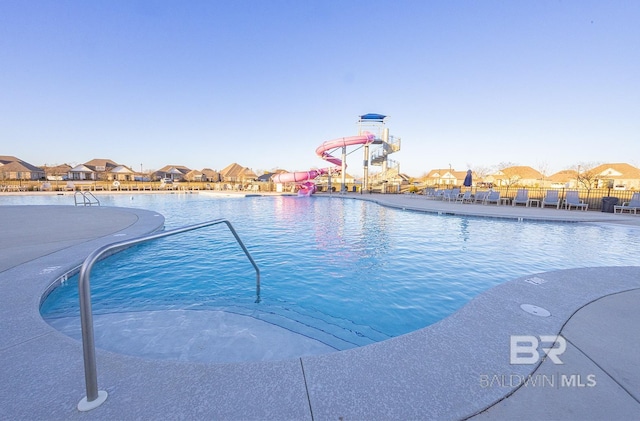 view of pool with a water slide