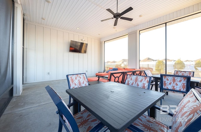 interior space featuring ceiling fan, wooden ceiling, and concrete floors