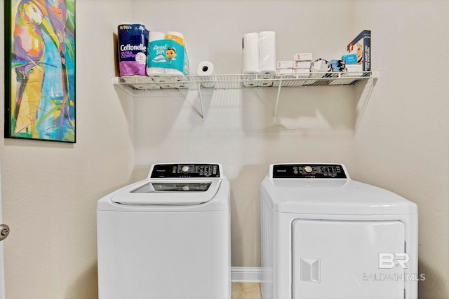 clothes washing area with laundry area and separate washer and dryer