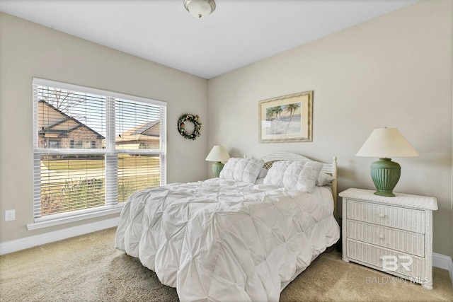 bedroom featuring carpet flooring and baseboards