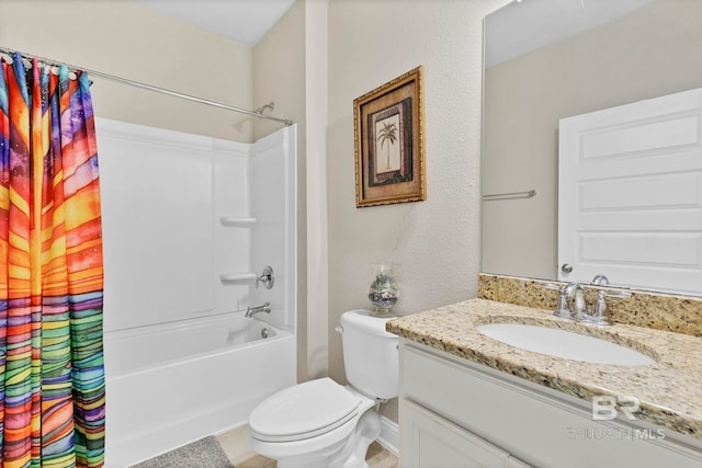 full bathroom with toilet, shower / bath combo, vanity, and baseboards