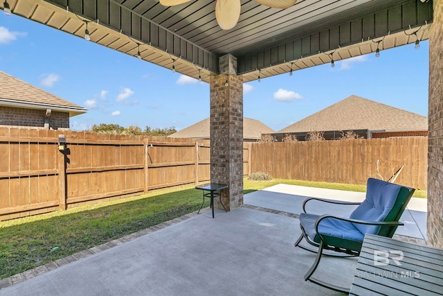 view of patio with a fenced backyard and ceiling fan