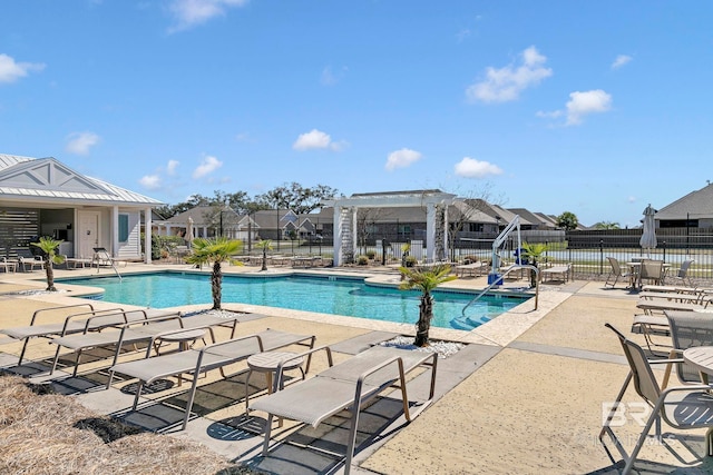 pool with fence, a patio, and a pergola