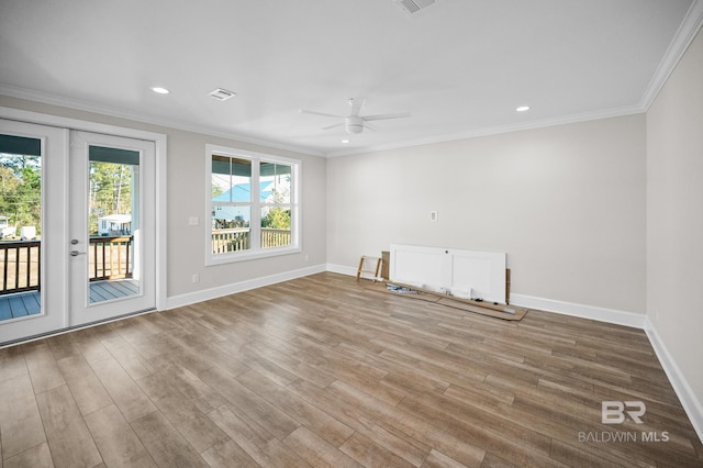 empty room featuring crown molding, ceiling fan, and hardwood / wood-style flooring