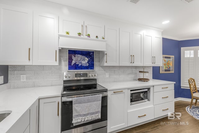 kitchen with stainless steel appliances, crown molding, dark hardwood / wood-style floors, and white cabinets