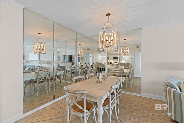 dining room featuring crown molding, a notable chandelier, and tile patterned floors