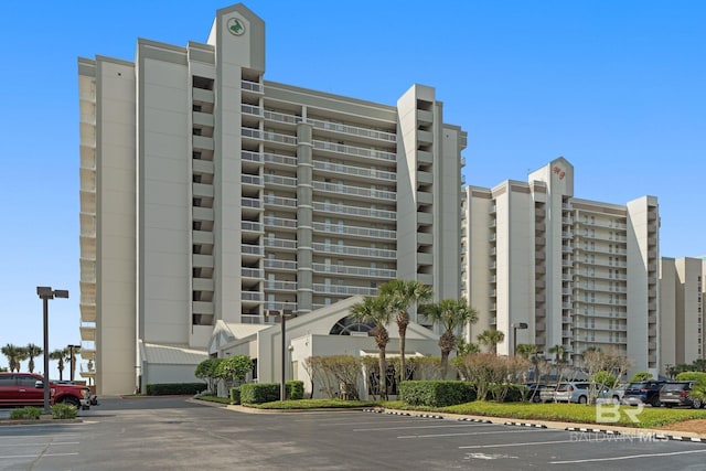 view of property featuring uncovered parking
