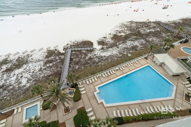 pool featuring a beach view and a water view