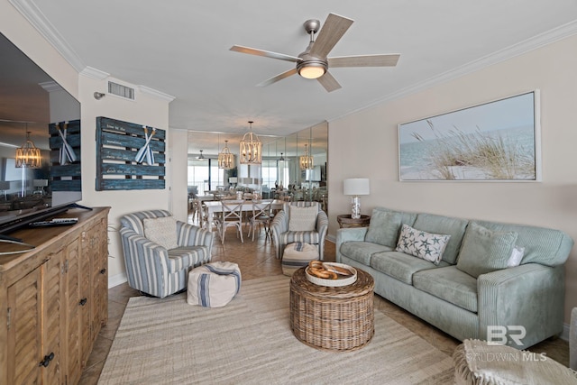 living area featuring crown molding, visible vents, tile patterned floors, and ceiling fan with notable chandelier