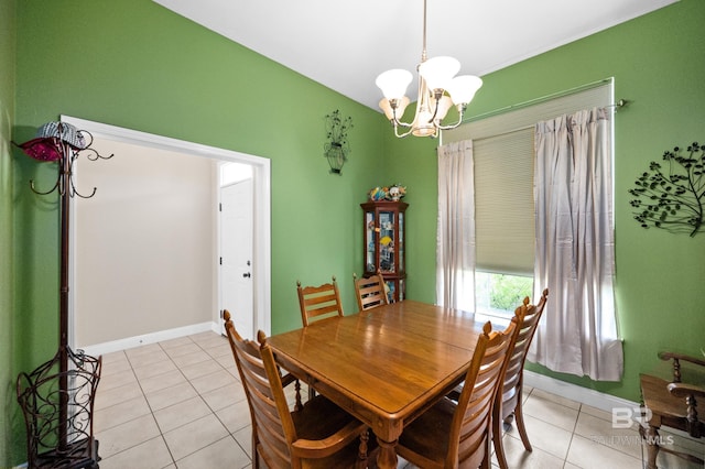 tiled dining space featuring an inviting chandelier