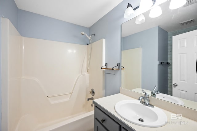 bathroom with vanity and bathing tub / shower combination