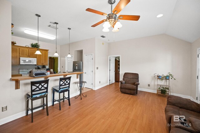 living room featuring light wood-type flooring, ceiling fan, and lofted ceiling