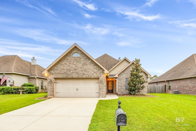 1077 Crown Walk Dr, Foley, AL 36535 - view of front facade with driveway, brick siding, a front lawn, a garage, and central AC