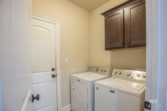 1077 Crown Walk Dr, Foley, AL 36535 - washroom featuring washing machine and clothes dryer and cabinet space