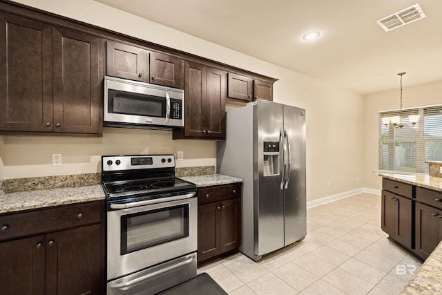 1077 Crown Walk Dr, Foley, AL 36535 - kitchen featuring stainless steel appliances, a chandelier, hanging light fixtures, visible vents, and dark brown cabinetry