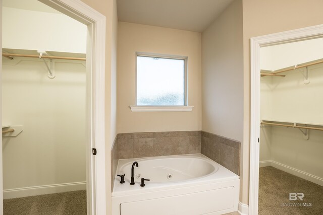 1077 Crown Walk Dr, Foley, AL 36535 - bathroom featuring a tub with jets and baseboards