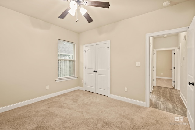 1077 Crown Walk Dr, Foley, AL 36535 - unfurnished bedroom with a ceiling fan, a closet, light carpet, and baseboards