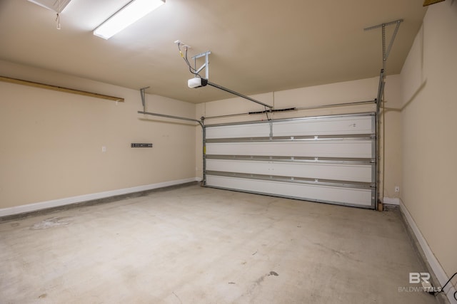 1077 Crown Walk Dr, Foley, AL 36535 - garage with baseboards and a garage door opener